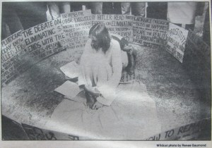 I sewed (by hand) the dress and backpack. Every weekday I made a new sign and demonstrated downtown. (The twin Superior Court Judges Roylston liked me and I made many friends downtown.) One day I collected all my signs and went to the university. My pic was on the front-page of the Daily Wildcat.